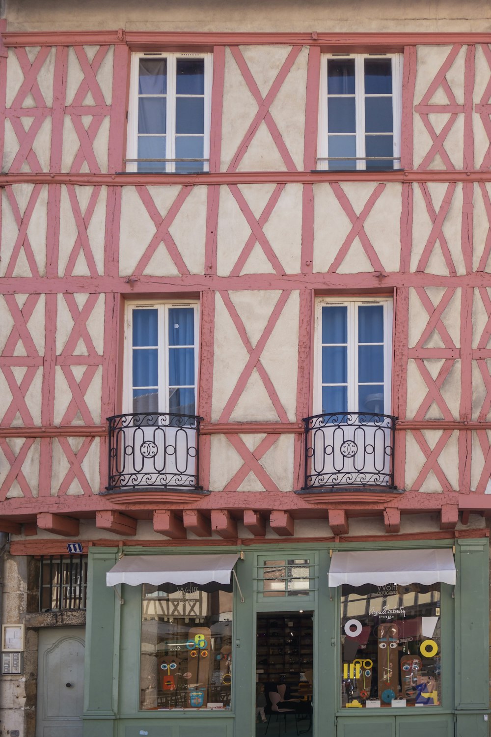 a pink building with windows