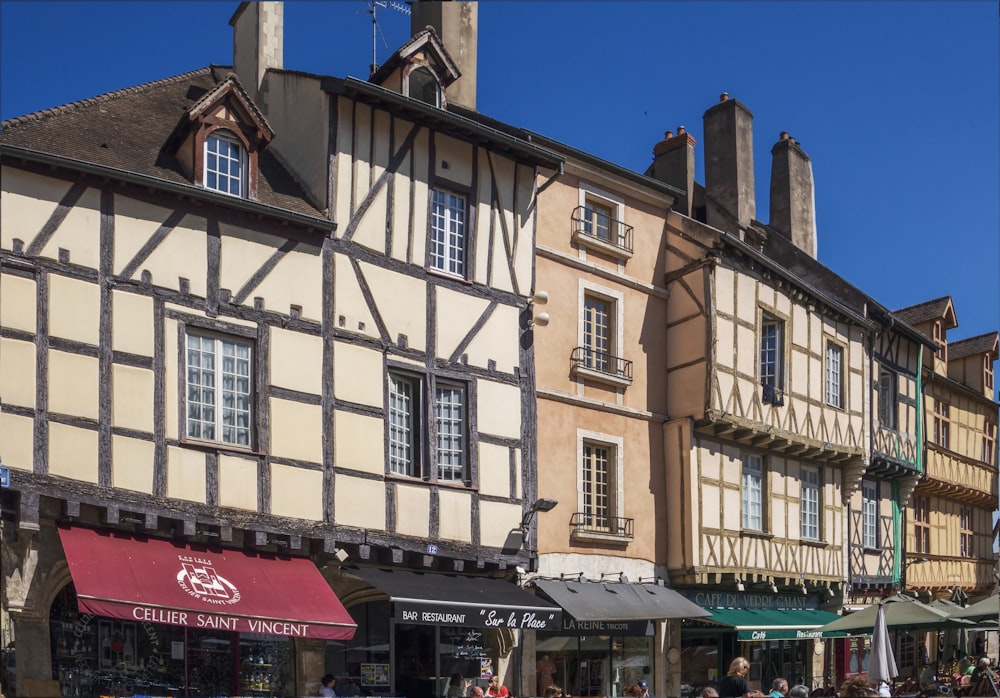 a row of buildings with umbrellas