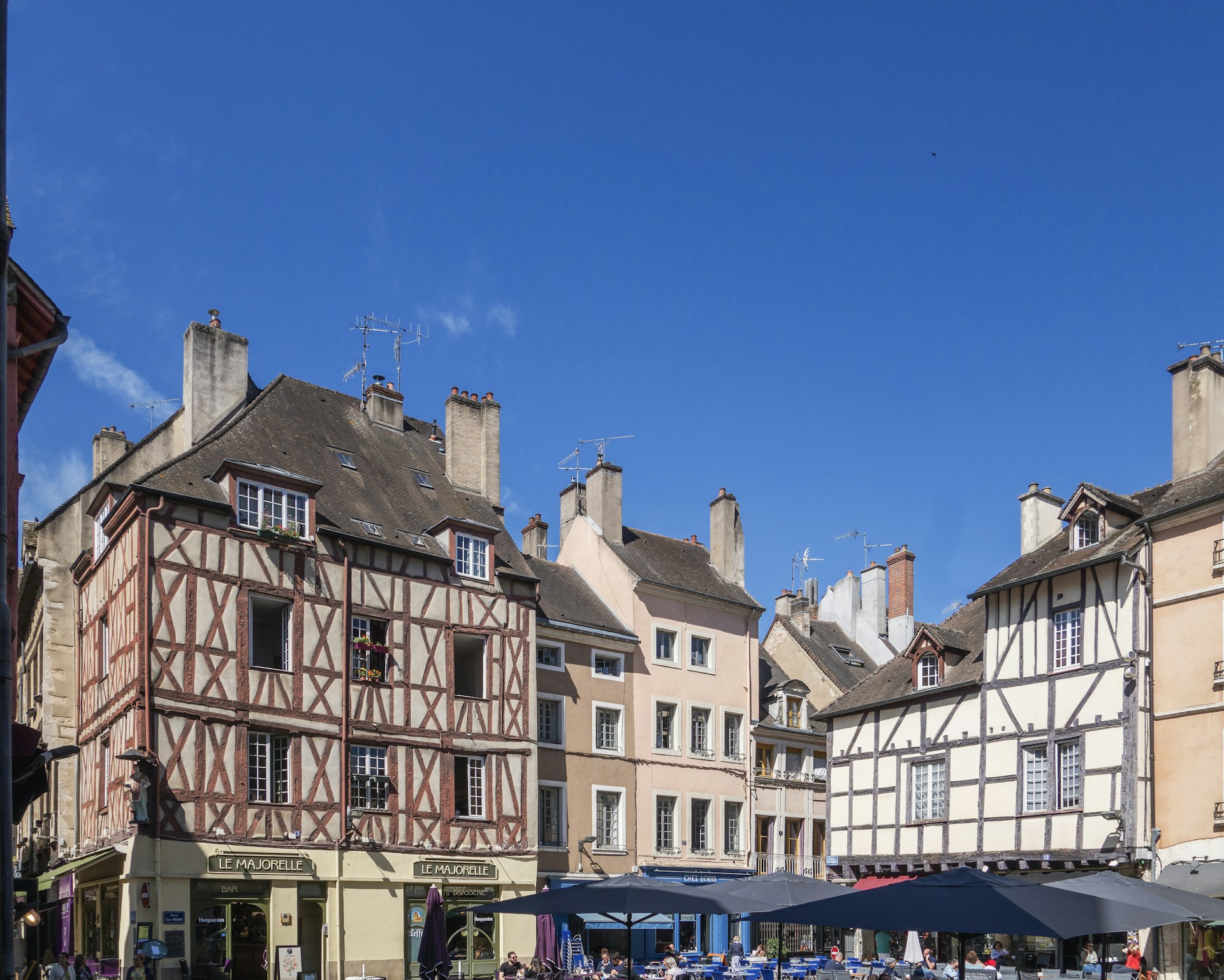 a group of buildings with a blue sky