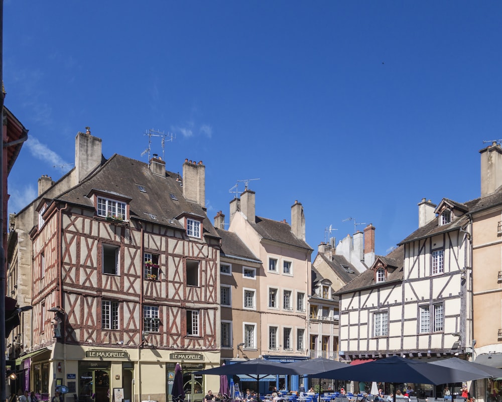 a group of buildings with a blue sky