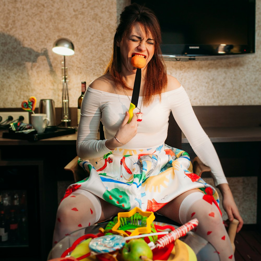 a woman eating a cake