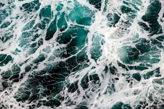 A serene turquoise wave symbolizing positive energy flow.