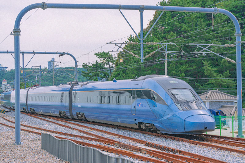Korean train traveling through scenic Korean landscape