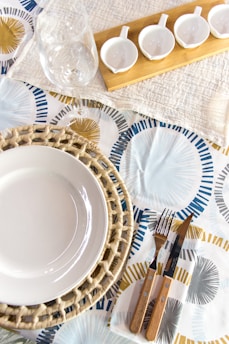 a table with plates and silverware