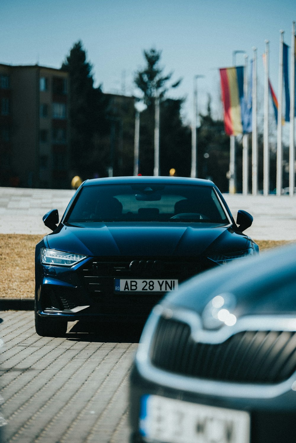 a black car parked next to a black car