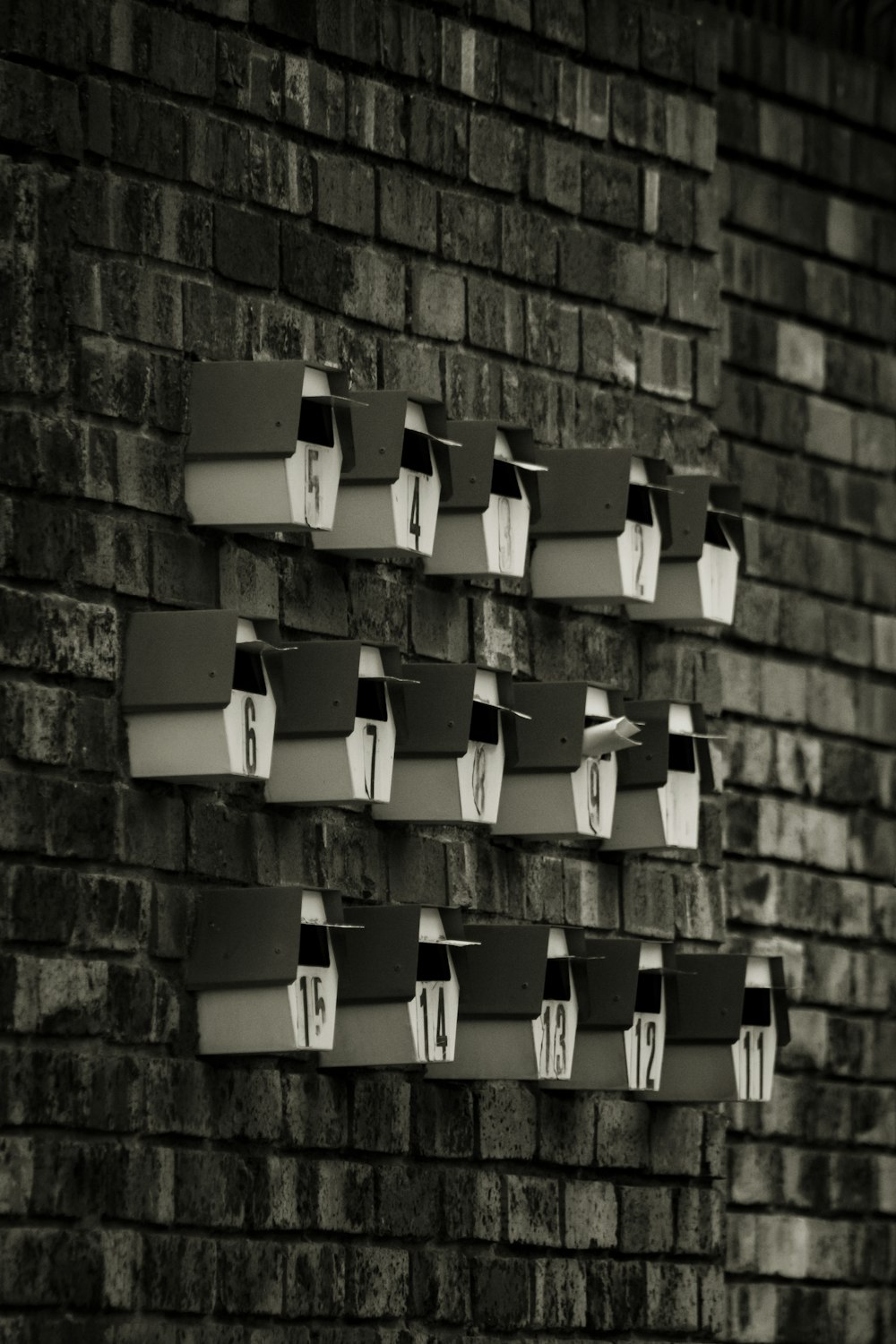 a brick wall with a group of boxes stacked on top of each other