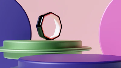 The matte black zeneio ring floating in a void with sharp geometric lines illuminated by neon green accents.