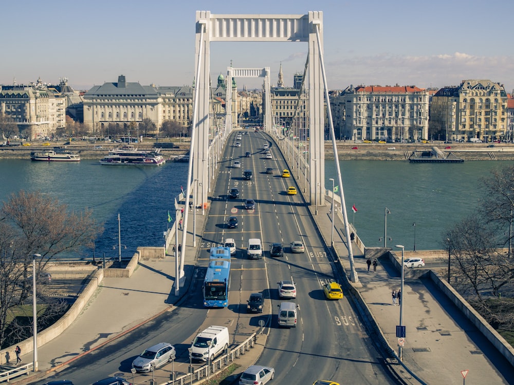 a bridge over a river with cars on it