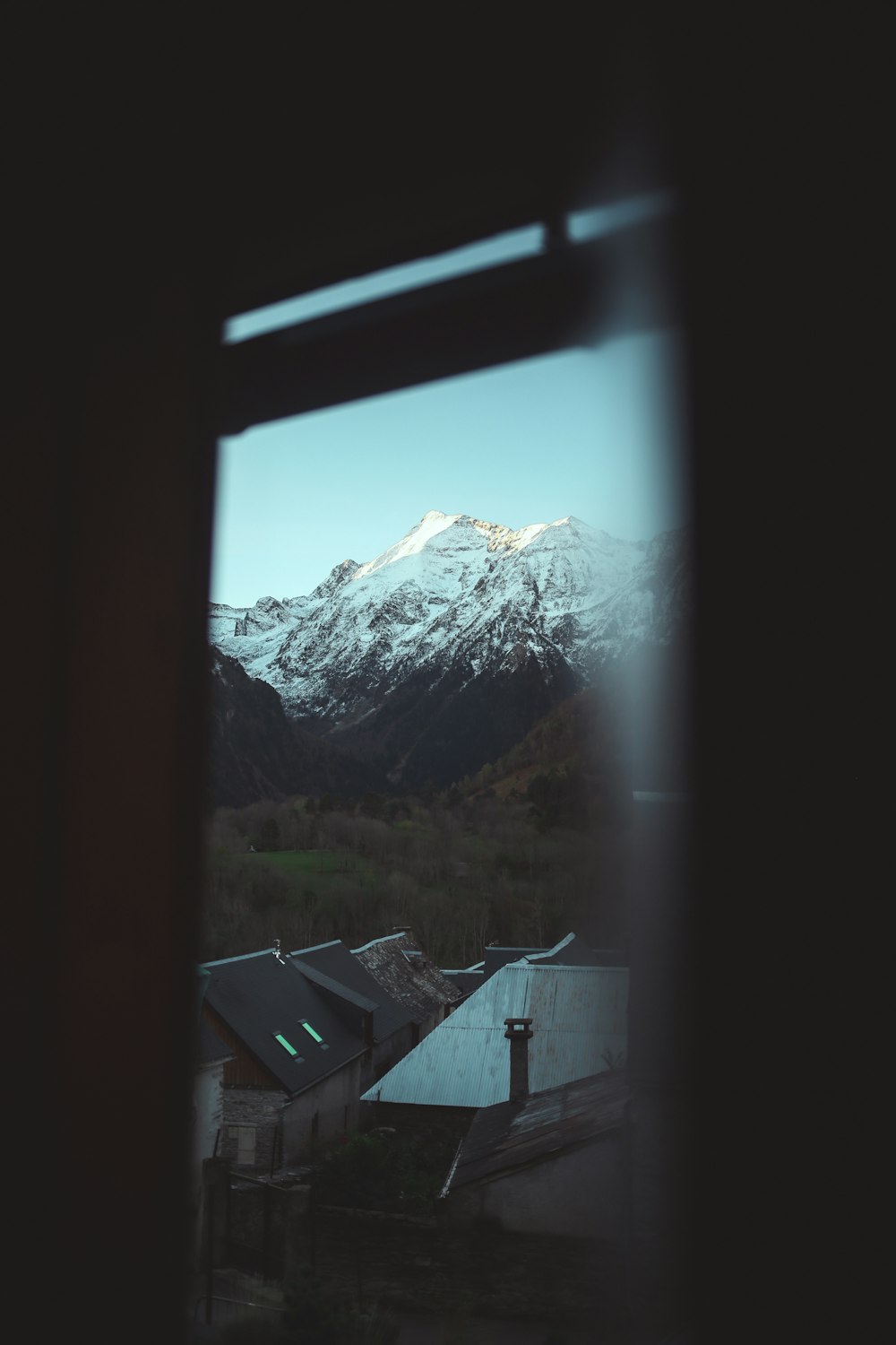 a view of a mountain from a window