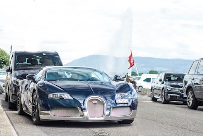 A luxurious vehicle parked in front of a Swiss hotel.