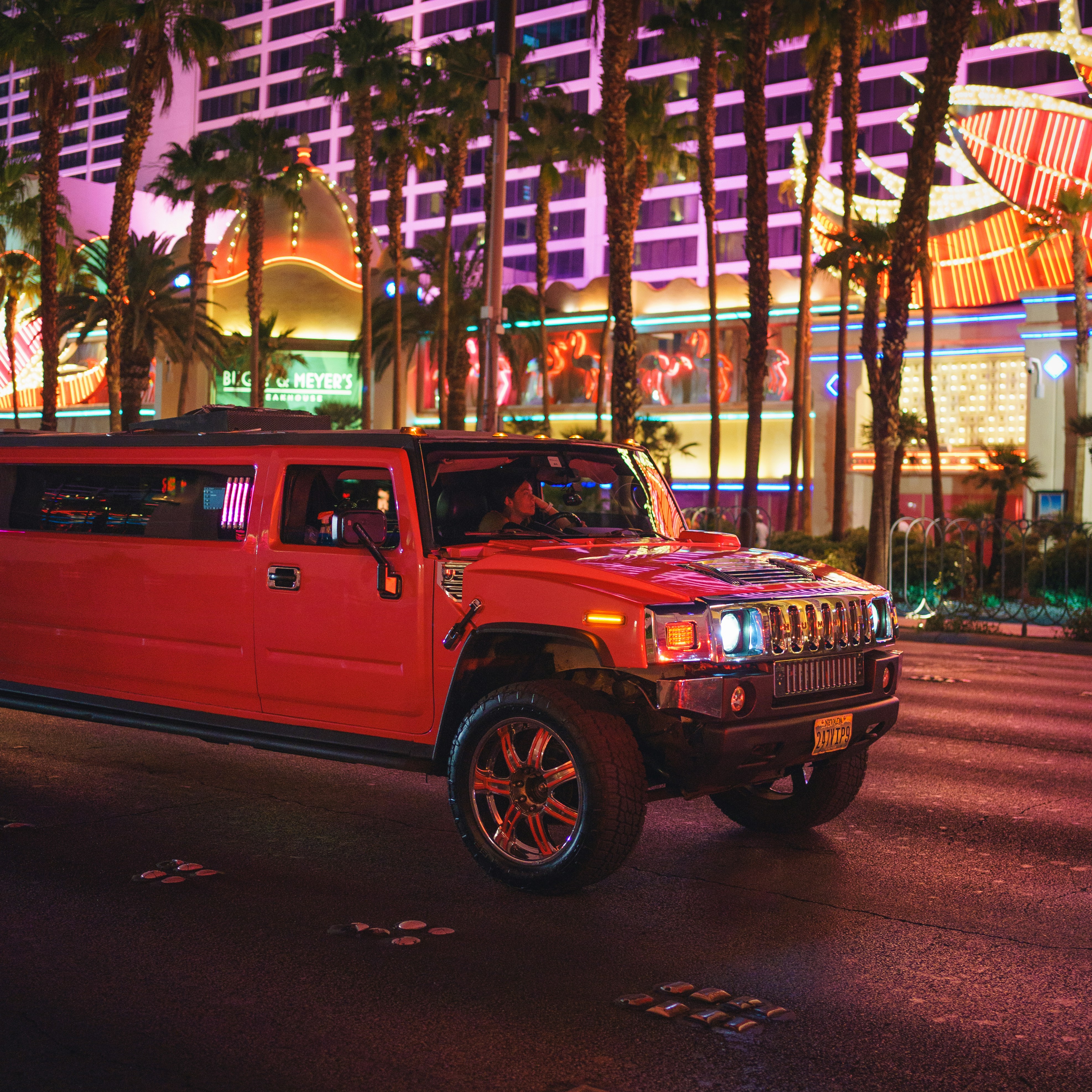 a red truck parked on the side of a street