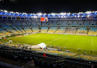 a football field with a crowd watching