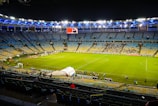 a football field with a crowd watching