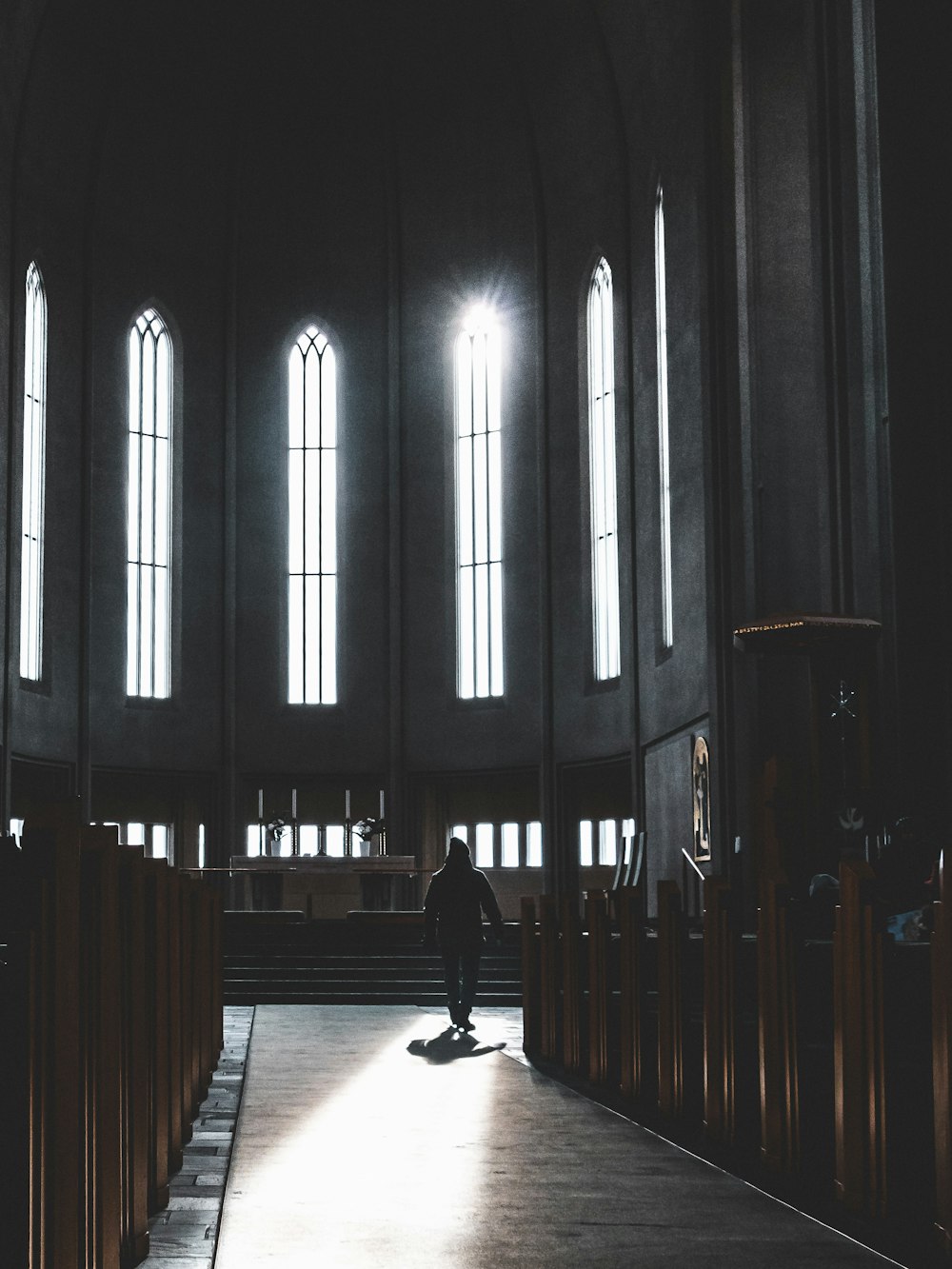 a person skateboards down a hall