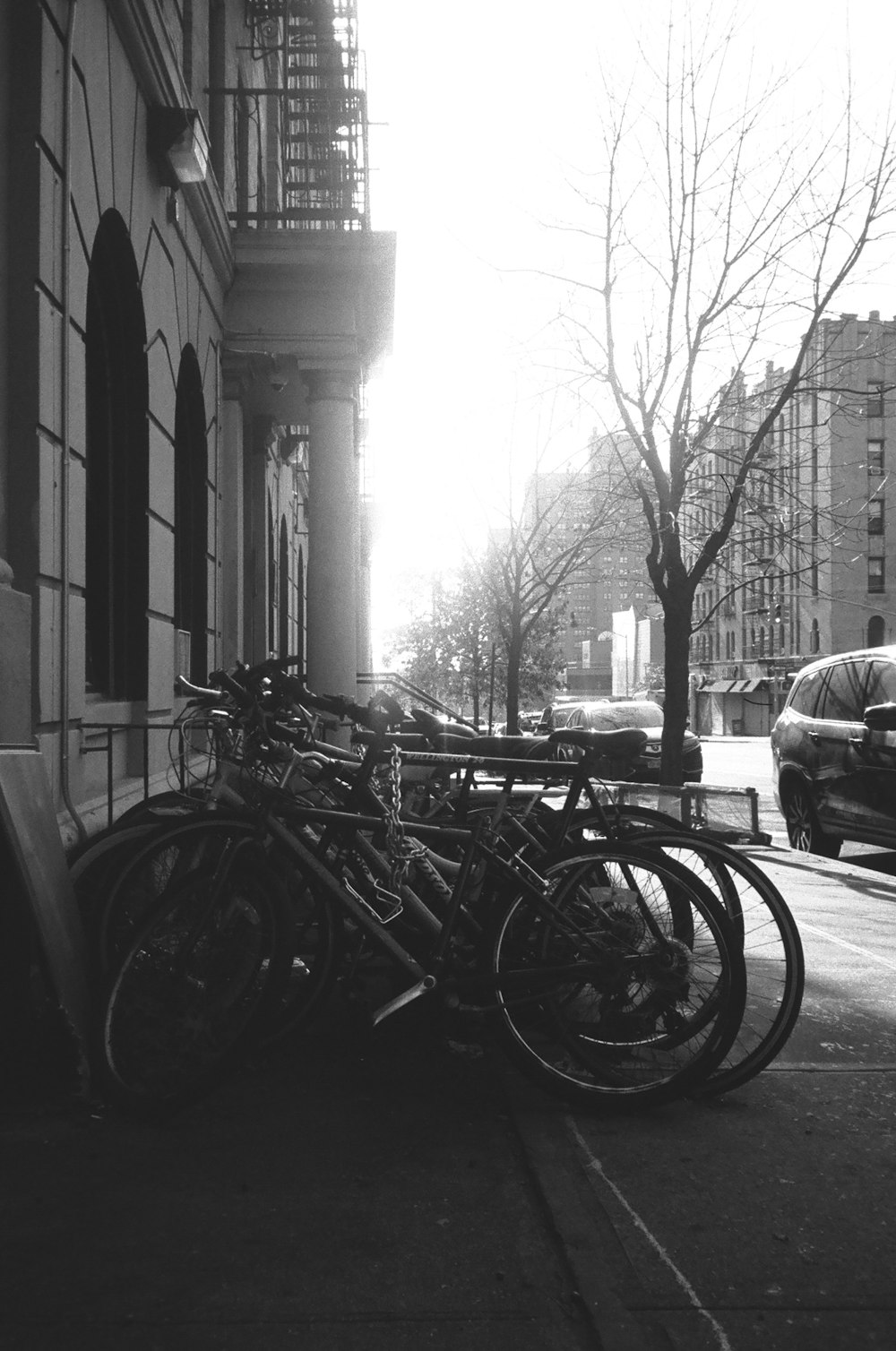 bicycles parked on the side of a street