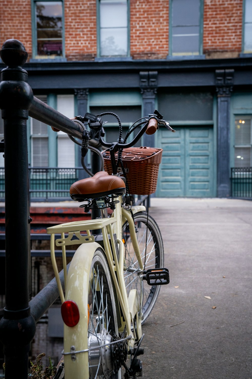 a bicycle is parked on the side of the street