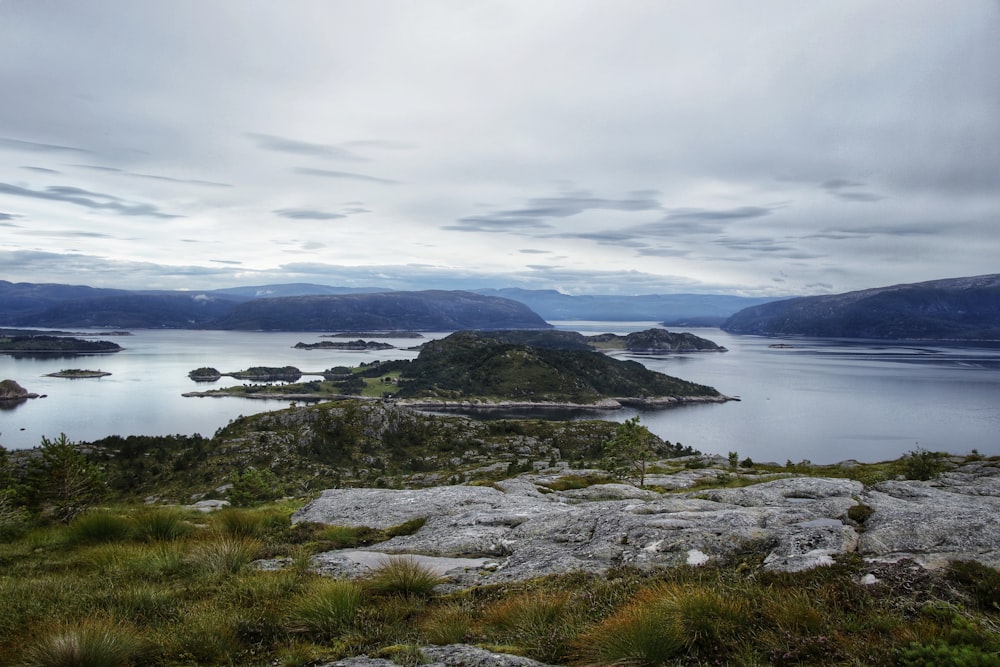 a body of water with land in the back