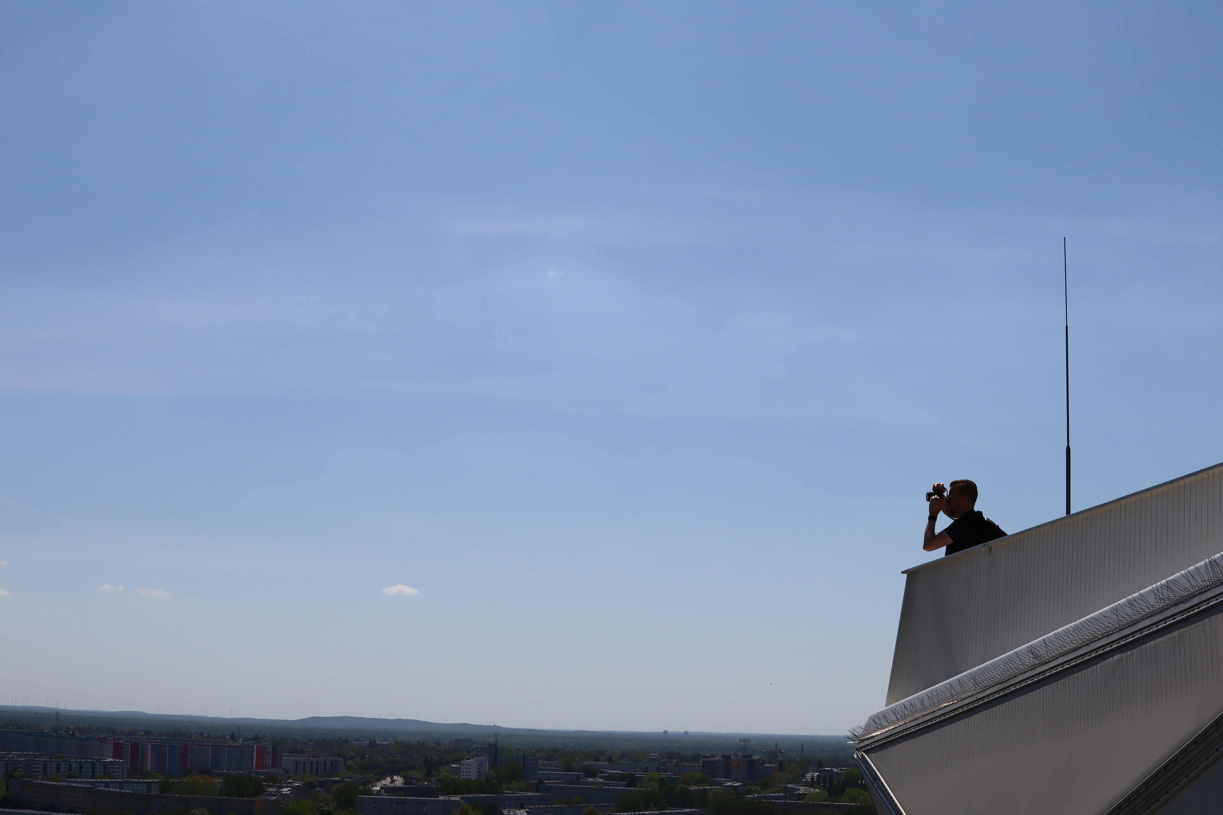 a person taking a picture of a city