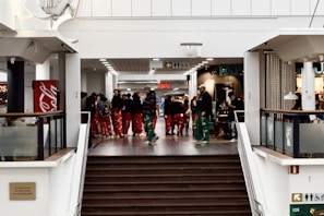 A group of friends enjoying a shopping spree at a mall.