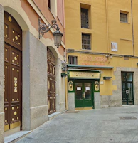 A storefront with professional rotulación and warm chocolate brown signage.