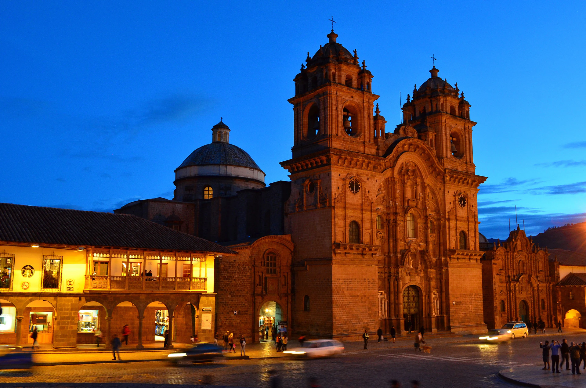 a large building with a dome and a fountain in front of it