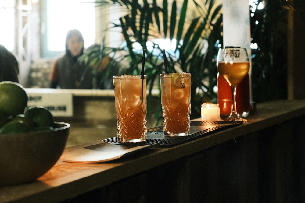 a group of glasses with liquid in them on a table