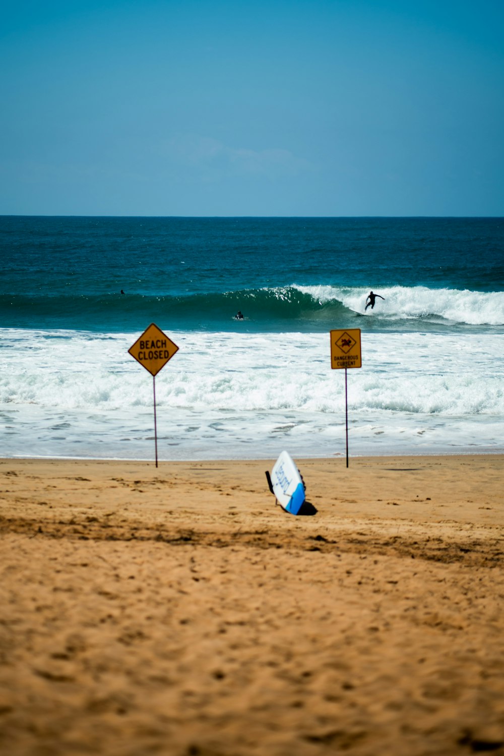 a sign on the beach