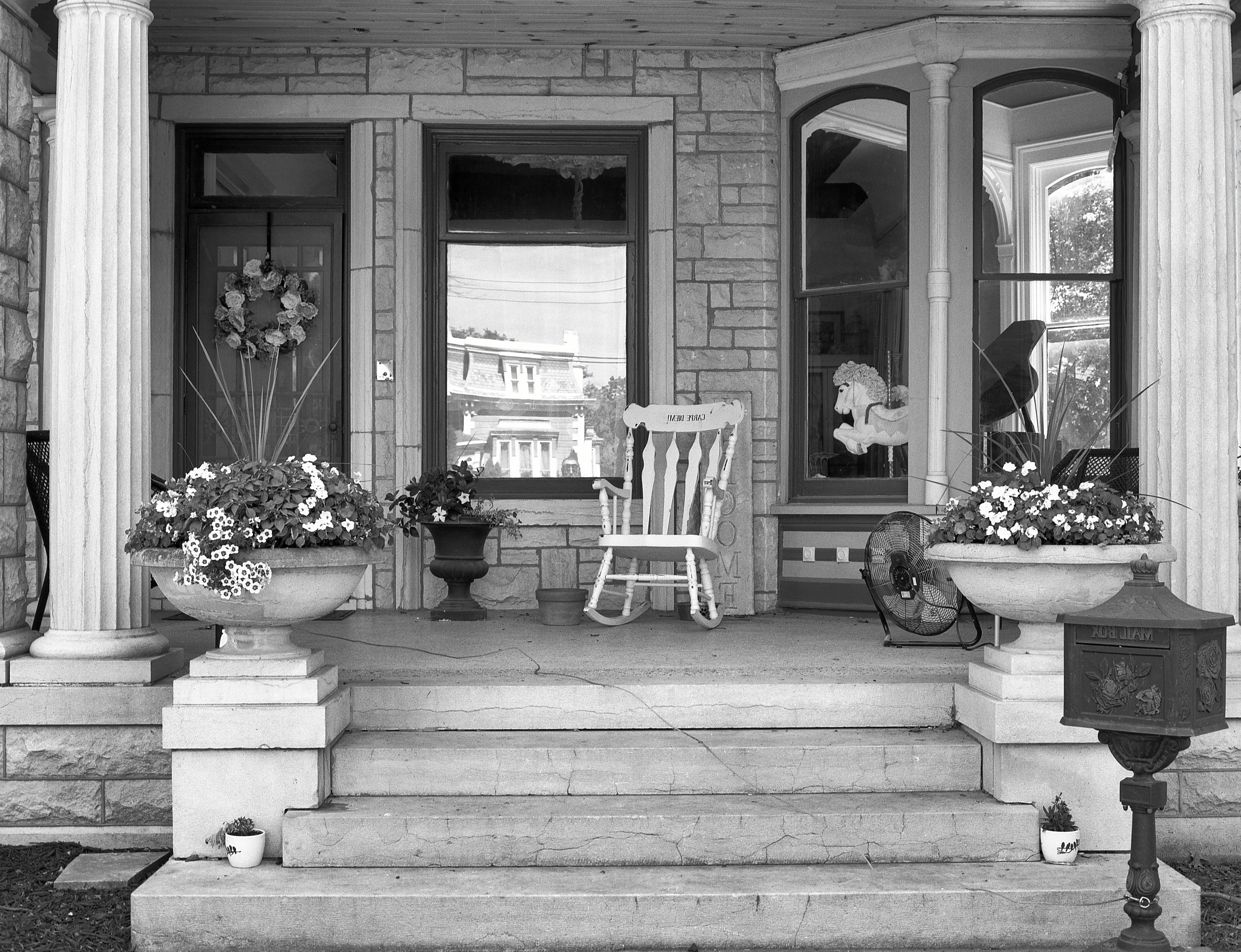 A chair and a table on the steps of a building