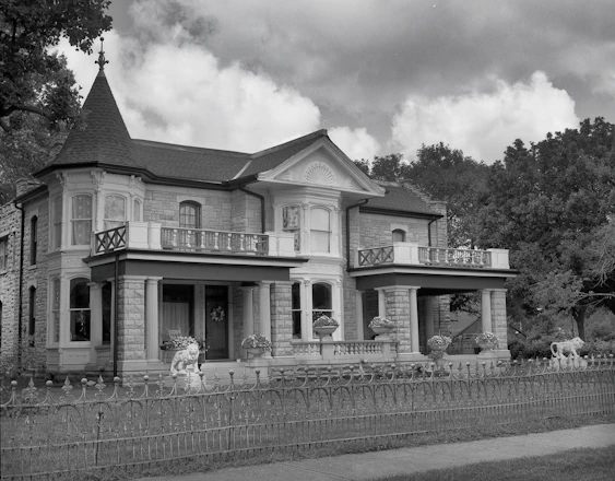 a house with a fence in front