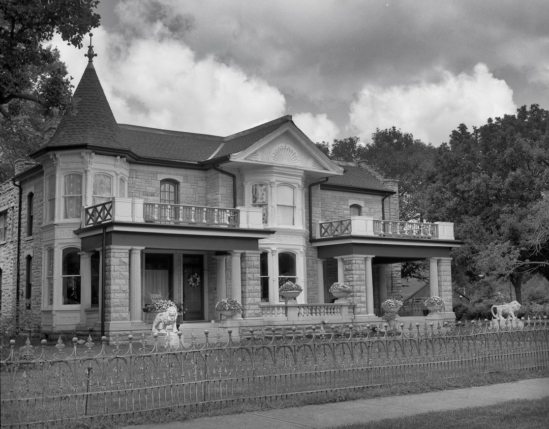 a house with a fence in front,