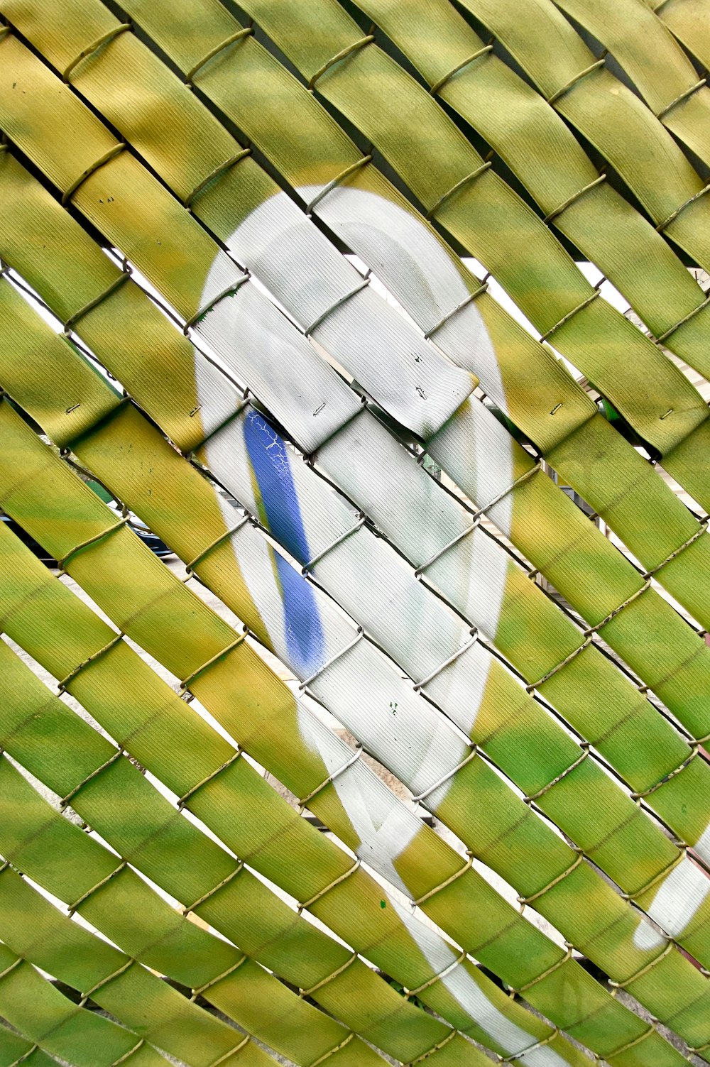 a close-up of a green and white woven surface