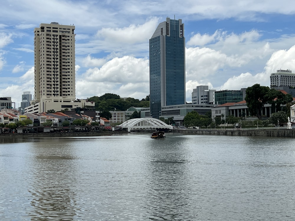 a body of water with buildings around it with Singapore River in the background