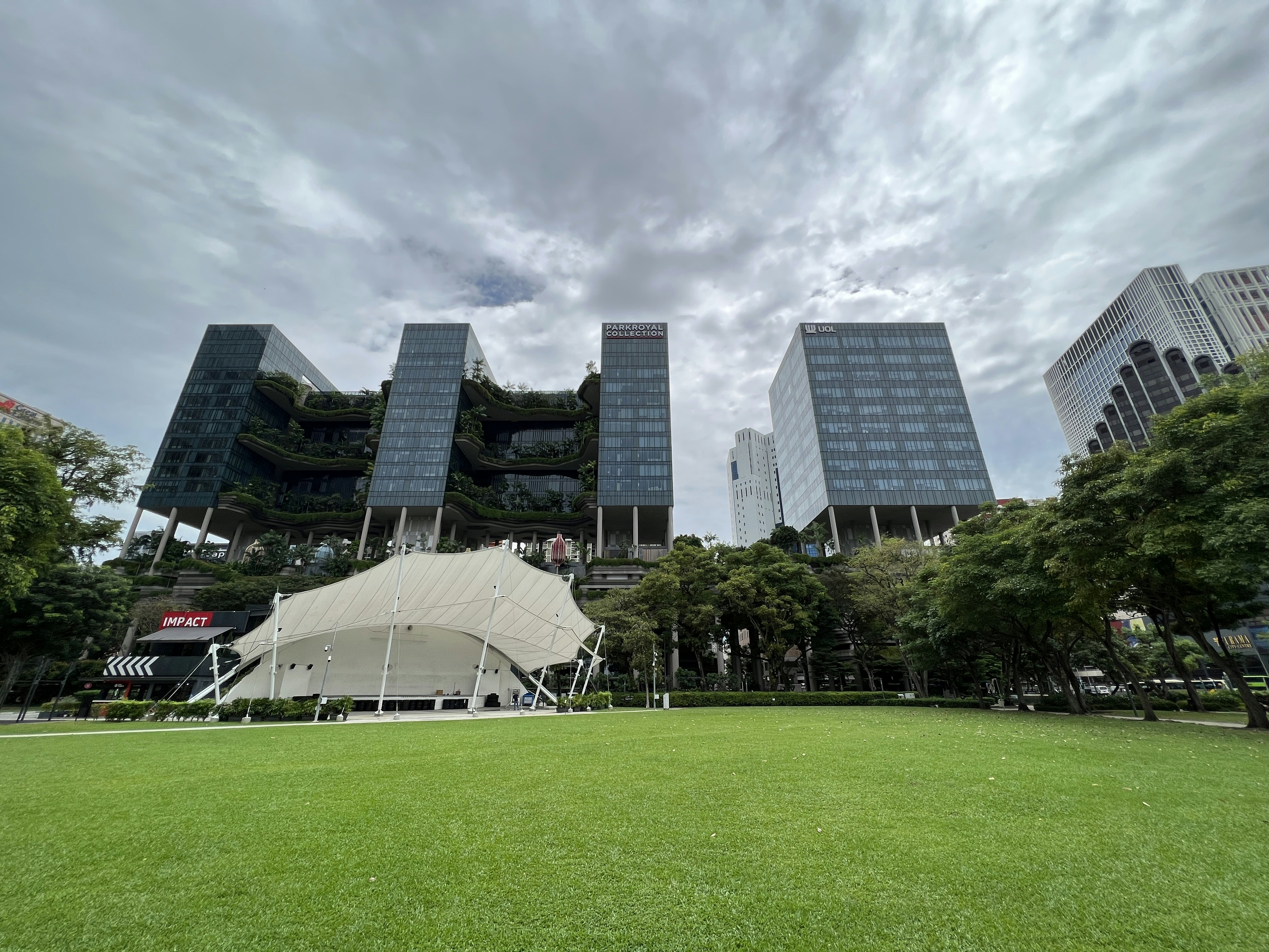 a large building with a white tent in front of it