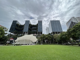 a large building with a white tent in front of it