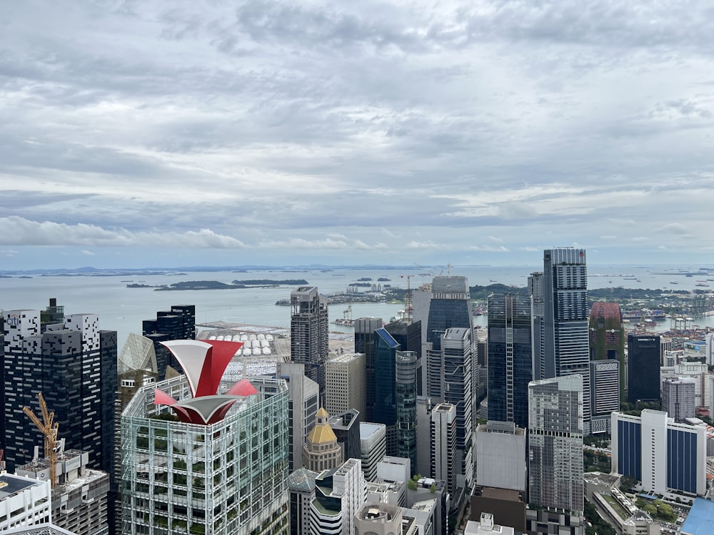 a city with a body of water in the background