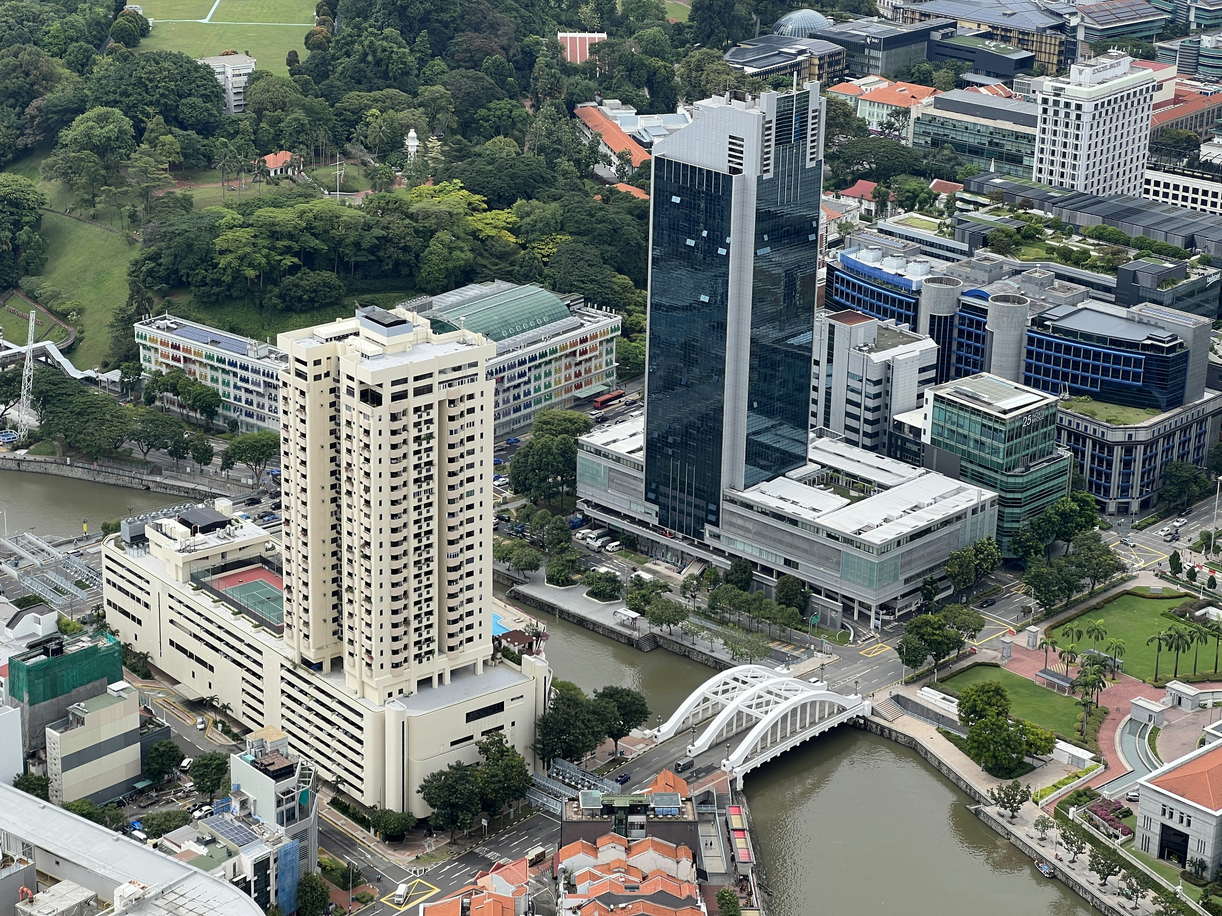 a river with buildings and trees