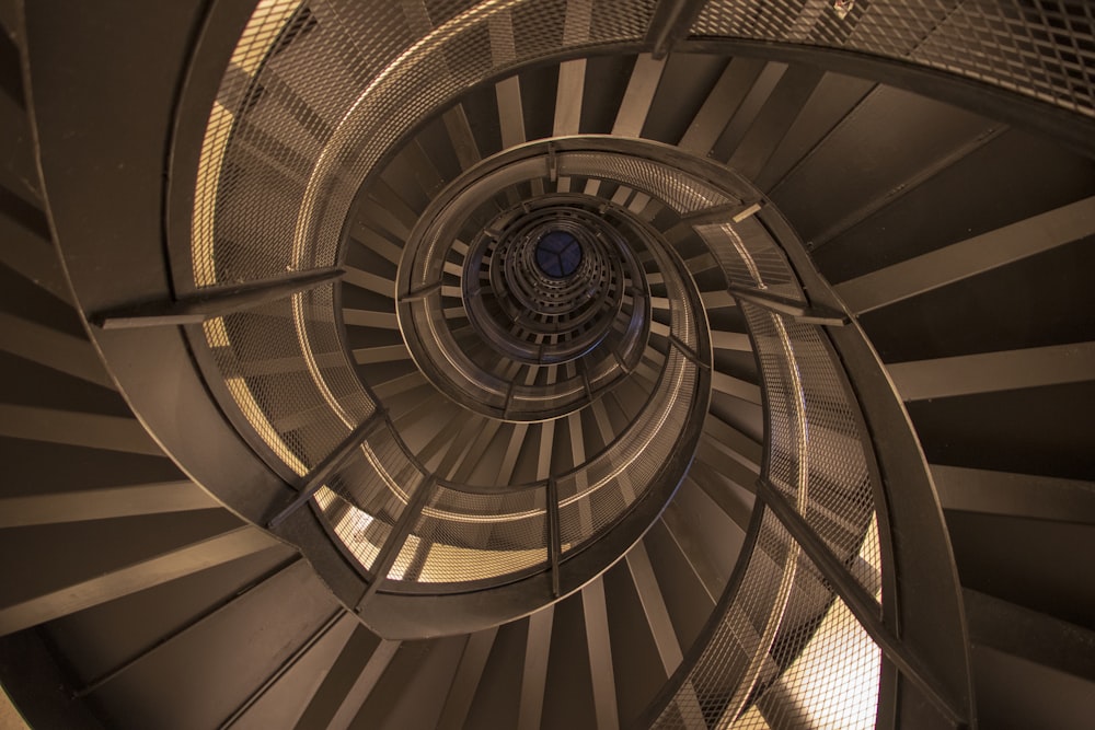 a spiral staircase with a circular ceiling