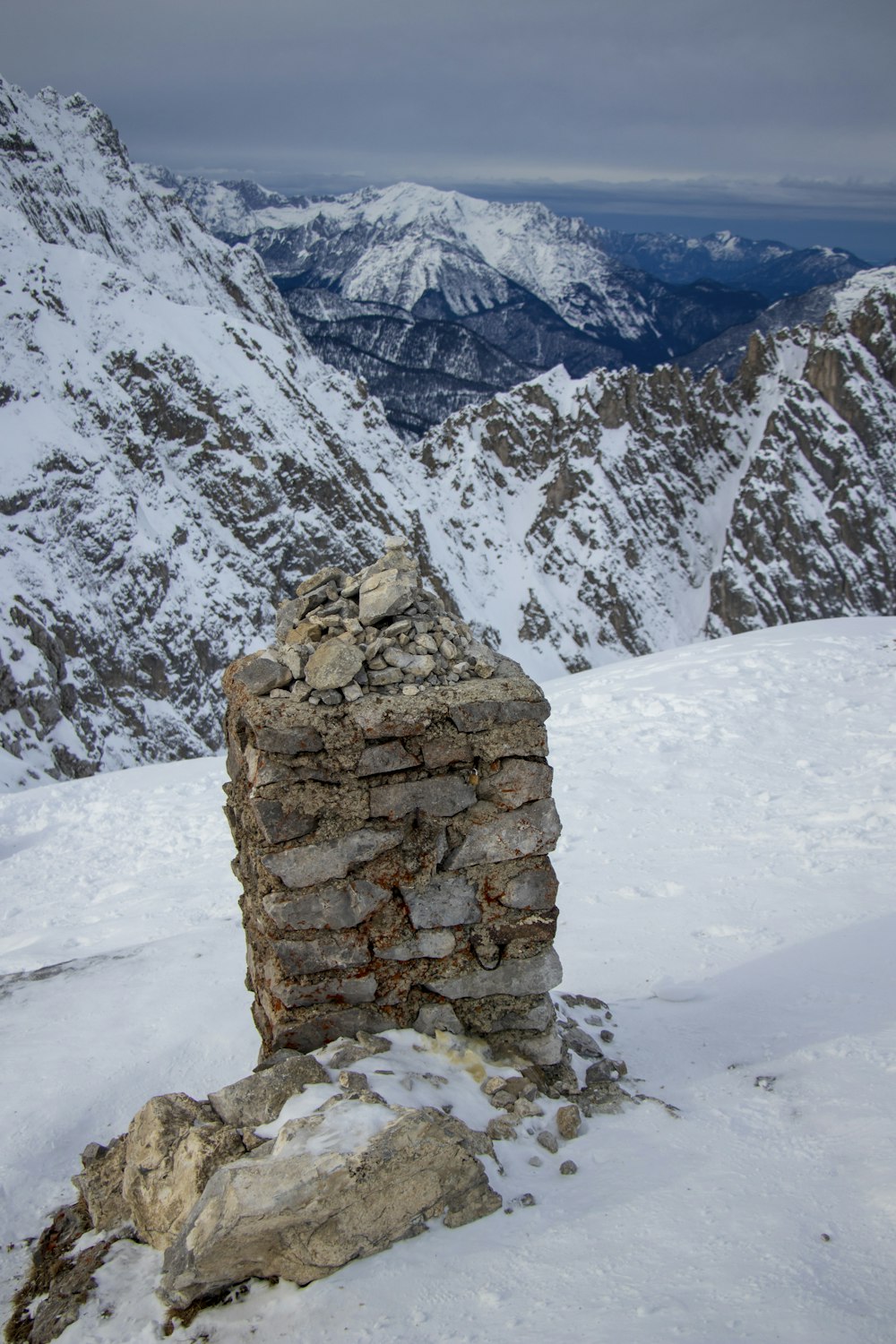 a stone wall in the snow