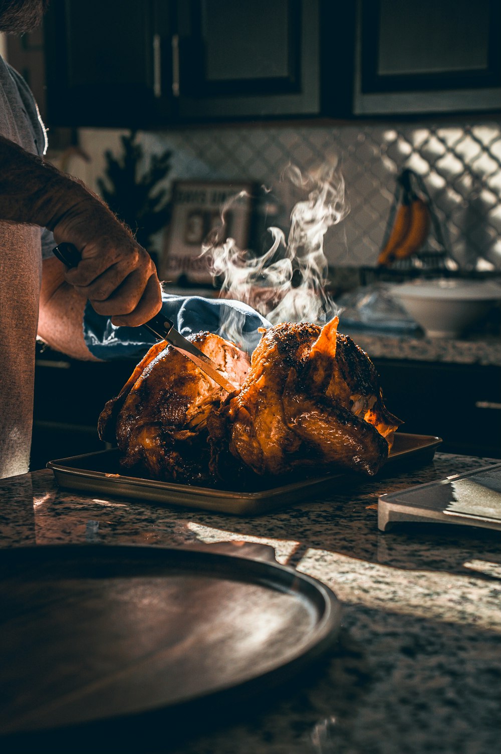 a person putting food on a grill