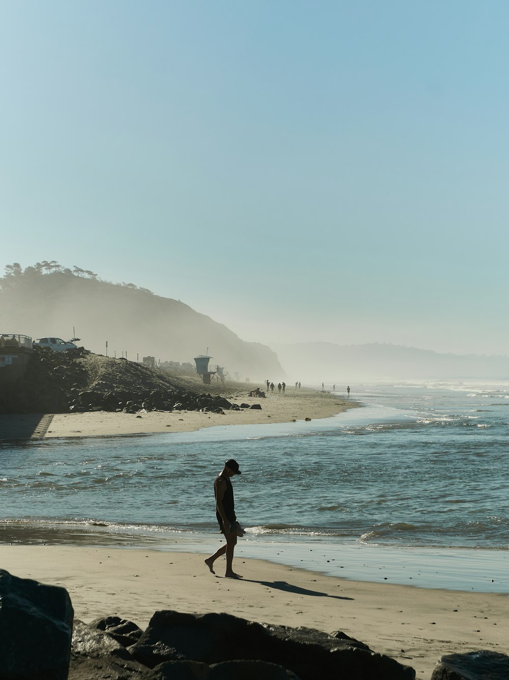 a man walking on a beach