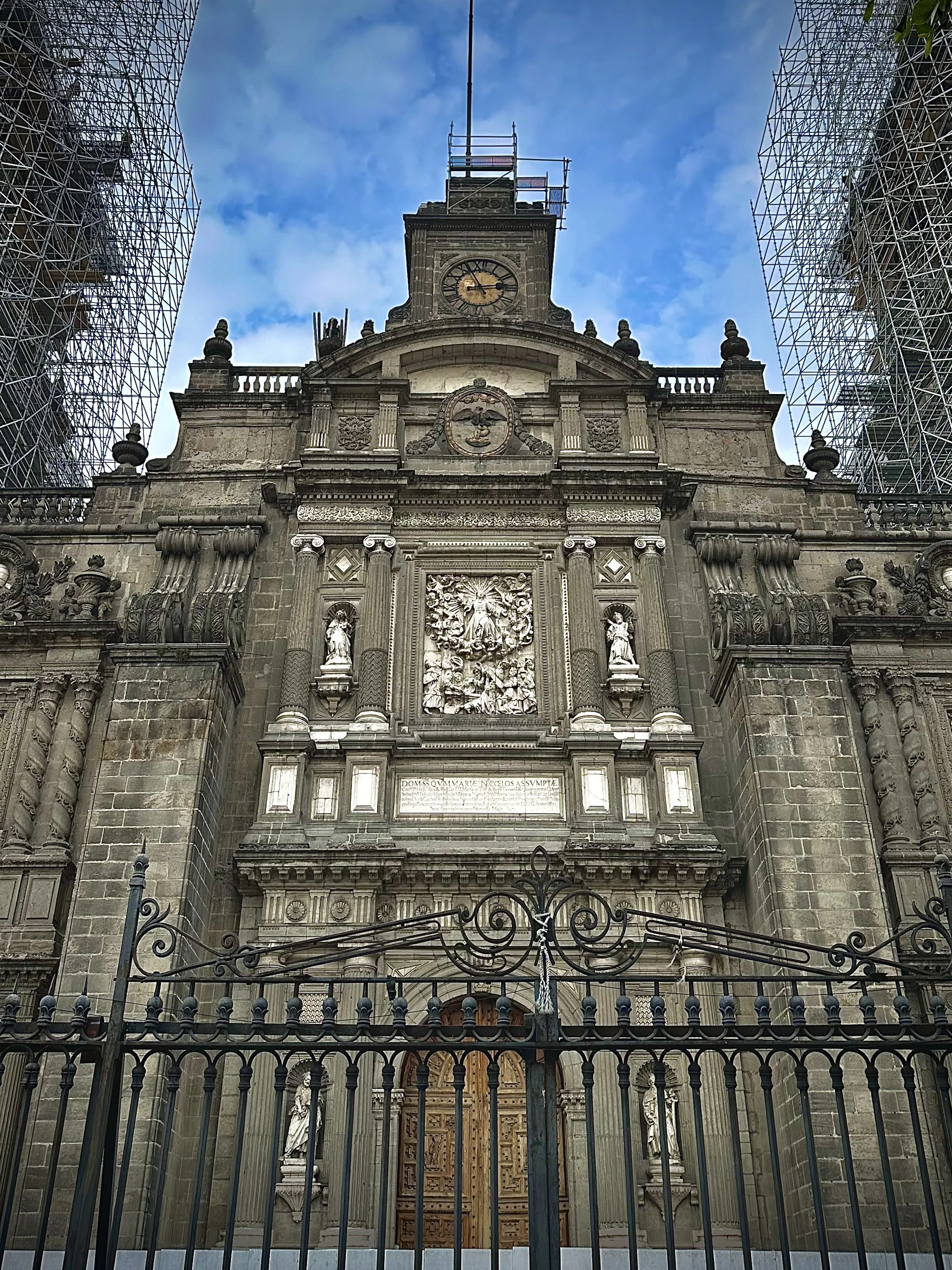 The ornate facade and clock tower of the Metropolitan Cathedral on Mexico City's Zocalo
