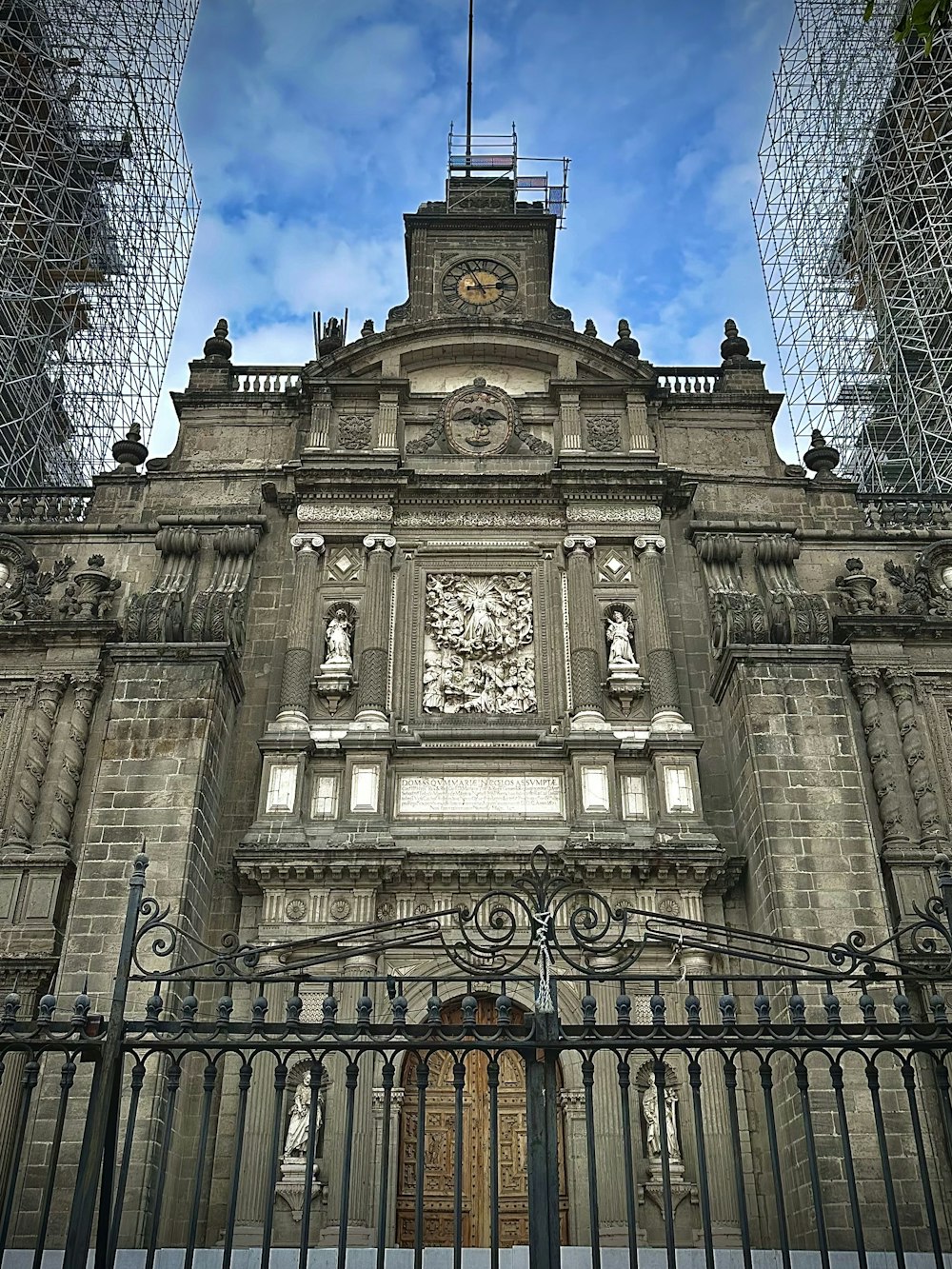 a large stone building with a clock tower