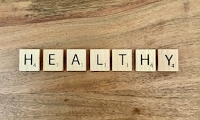 a group of white boxes with black text on a wooden surface