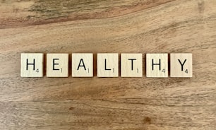 a group of white boxes with black text on a wooden surface