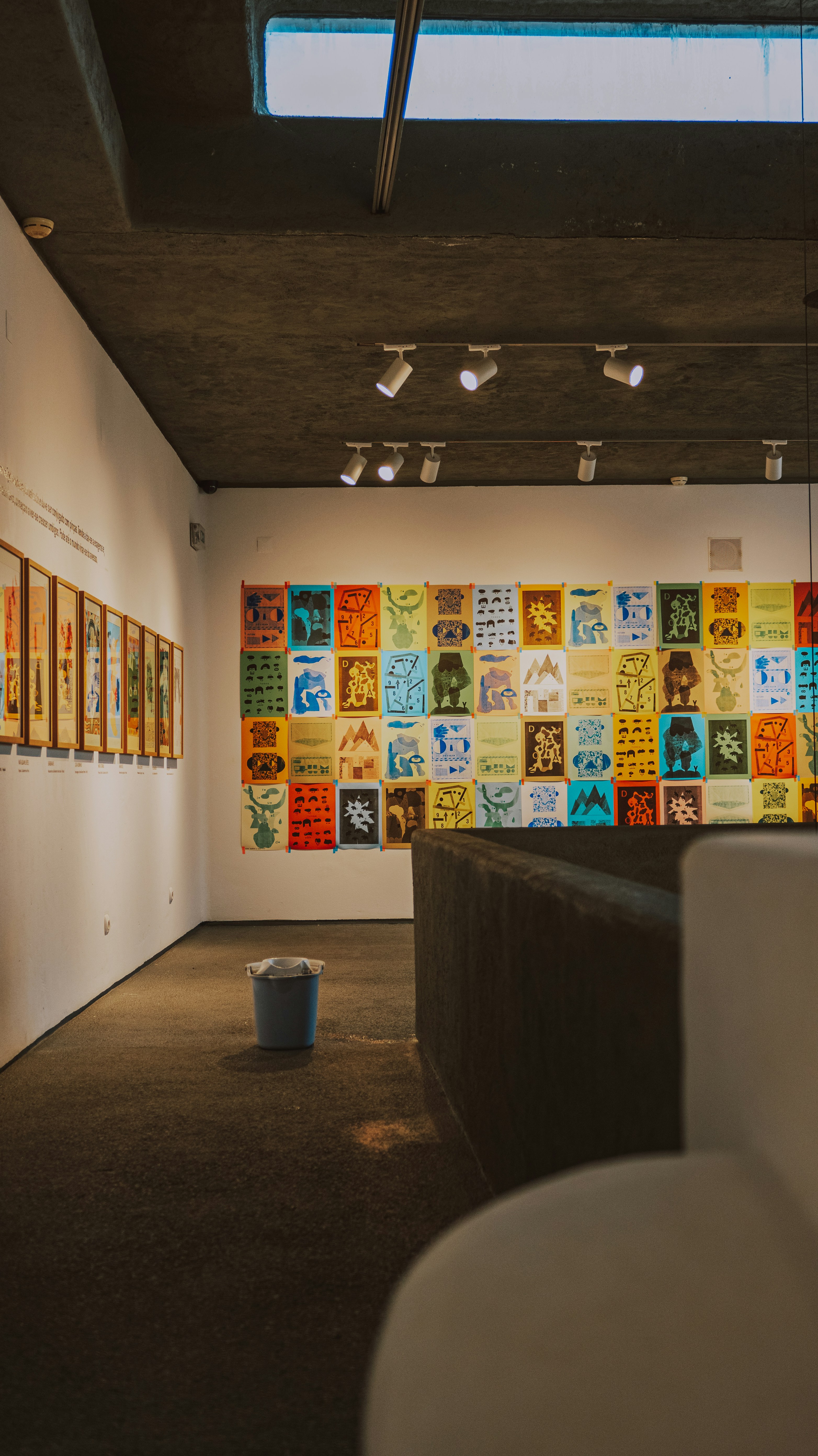 Bright gallery wall covered with colorful printed posters