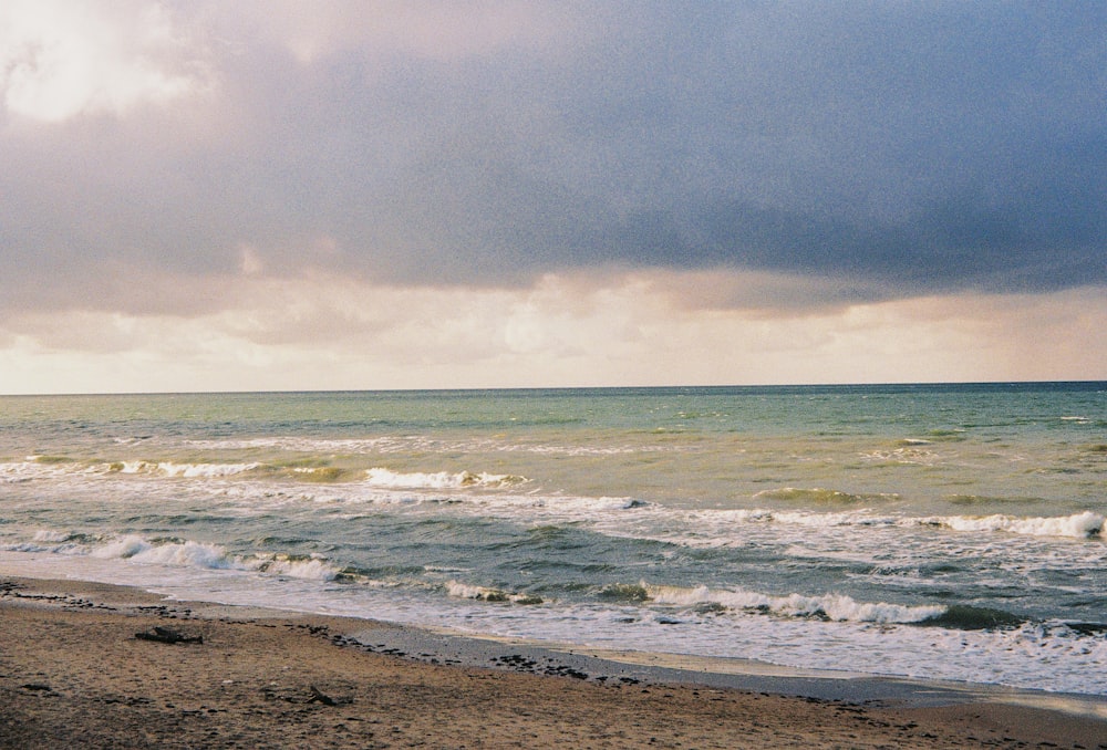 a beach with waves crashing