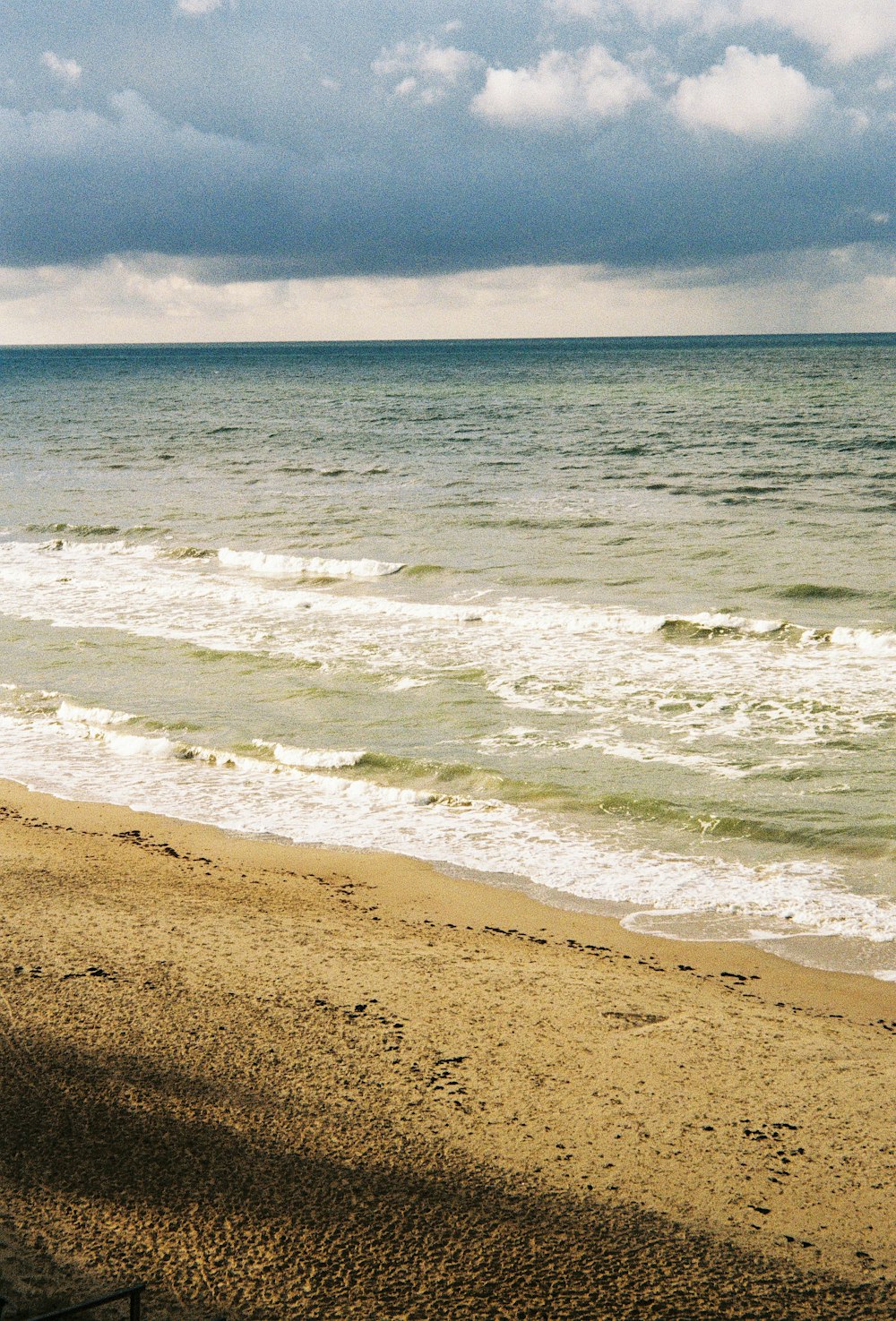 a beach with waves crashing