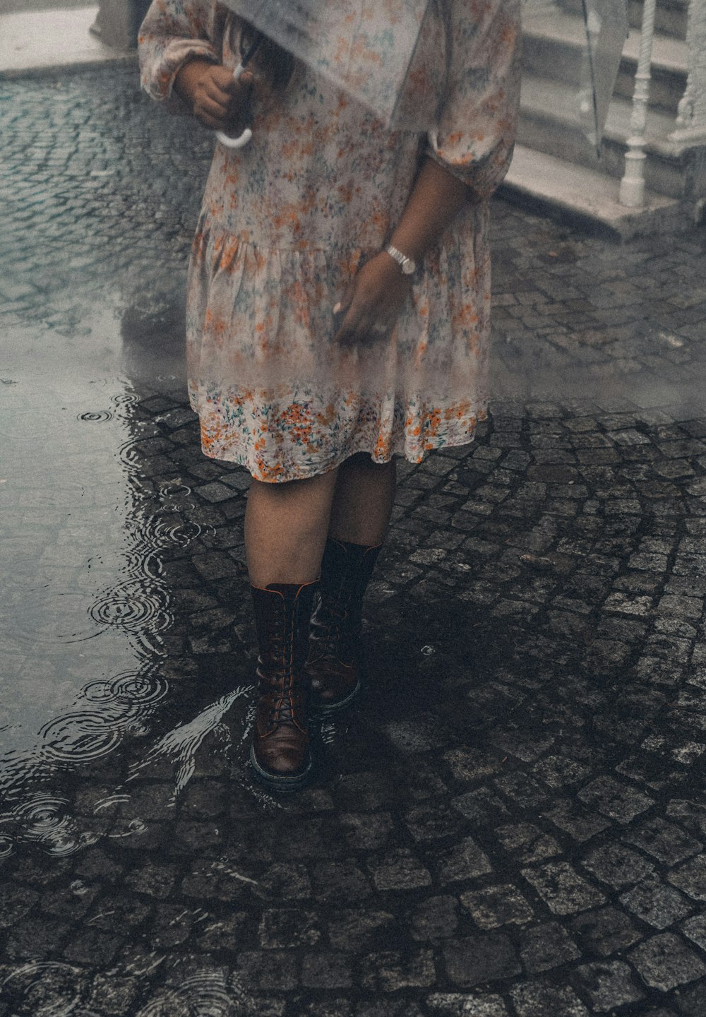 a person wearing a skirt and boots