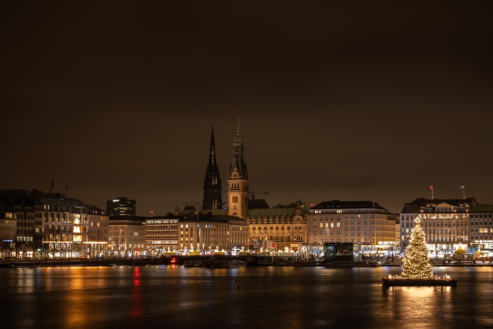 a city with a river and a large tower in the middle