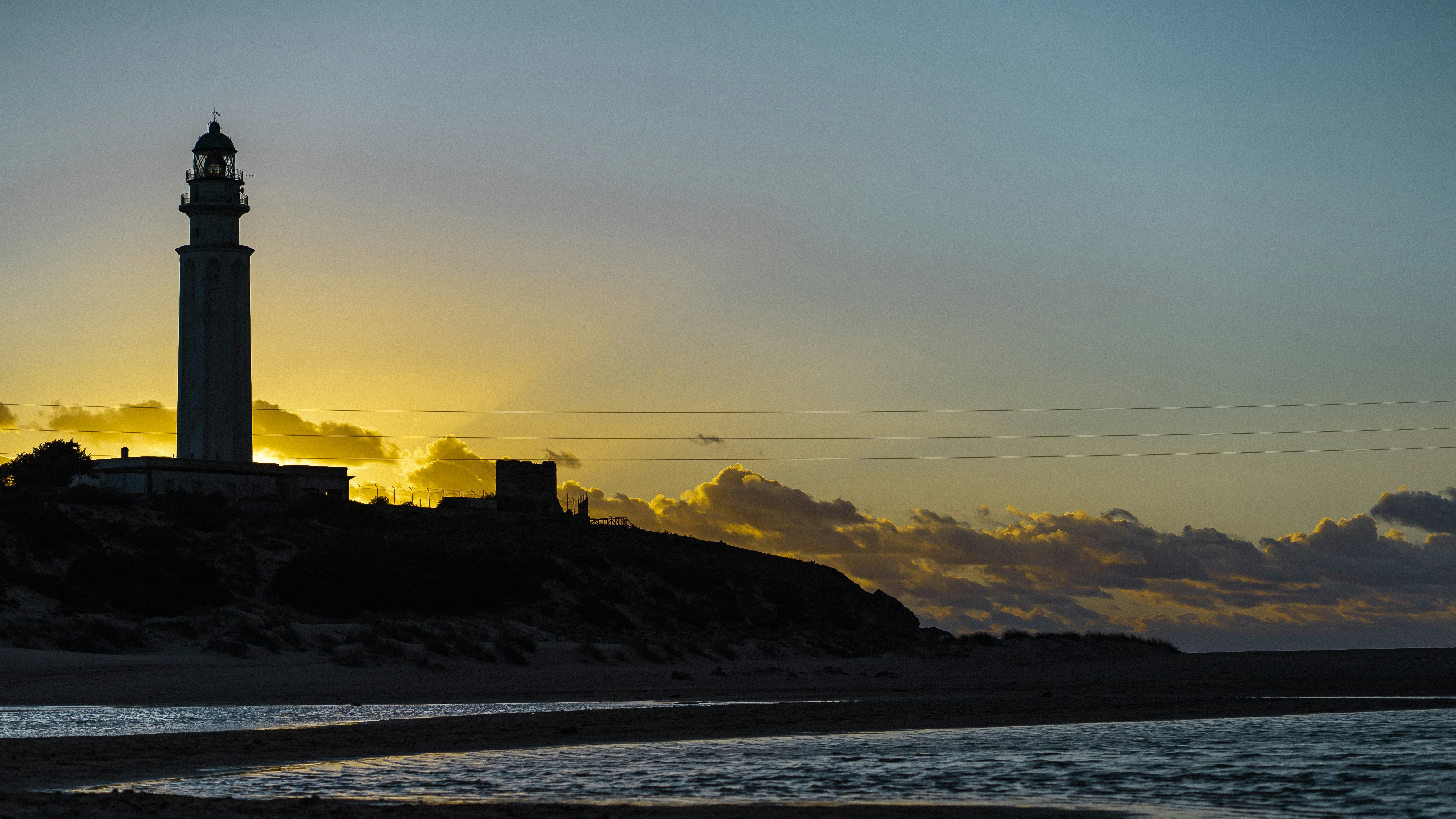 a lighthouse on a rocky island